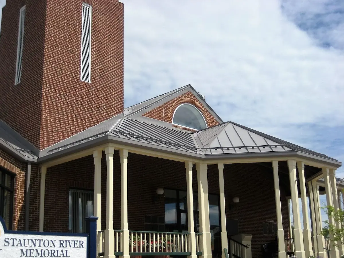 Skilled roofing craftsmen working on a residential roof in Parsonville